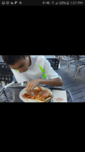 Only Adam will order a veggie burger with bacon.